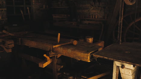 old wooden workshop with tools and rustic furniture in a quiet setting