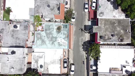 drone view from high above houses in the residential area in santo domingo, beautiful sunny day