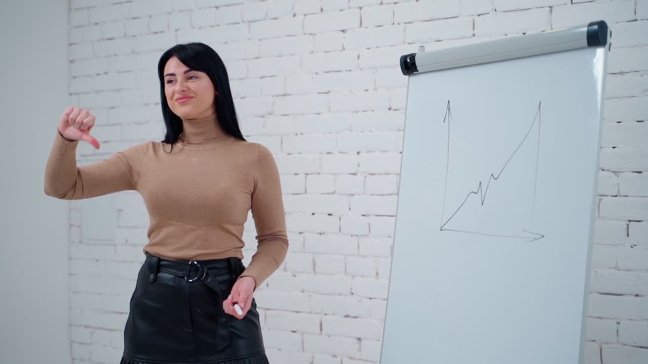 Woman using whiteboard. Young business woman standing near display board