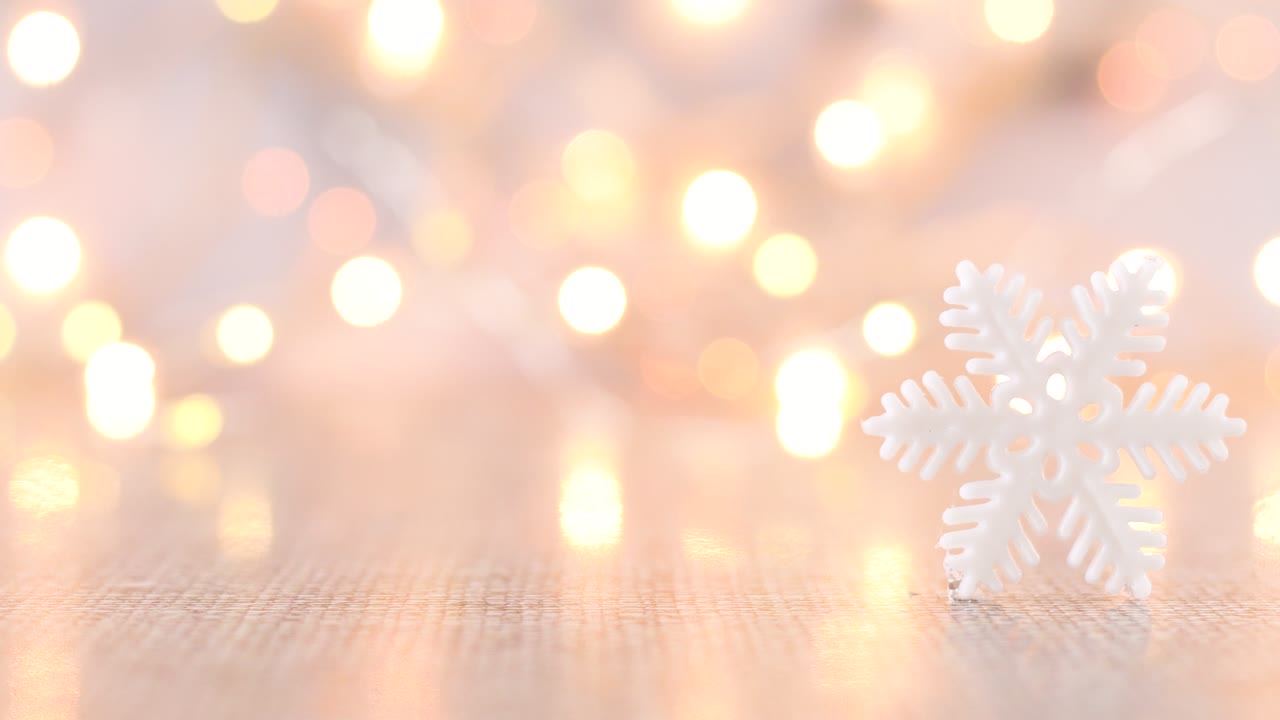 White Christmas snowflake with blinking lights at the back on light ...