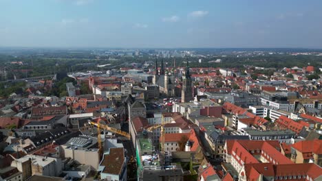 halle saale district court building, showcasing its impressive architecture and the surrounding cityscape. best aerial view flight speed ramp hyper motion time lapse