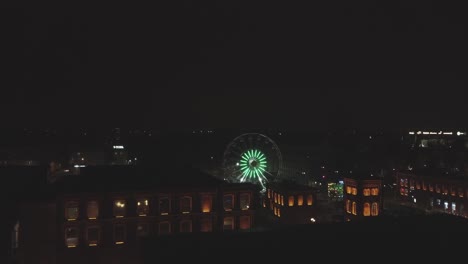 Night-time-Drone-video-of-a-Ferris-wheel-in-manufaktura-lodz-poland