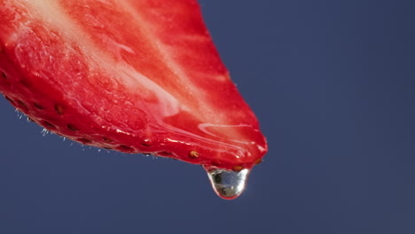 close-up of a strawberry slice with a water drop