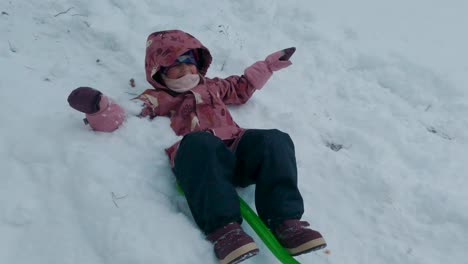 happy girl kid pulling sled sledding slide laughing family of many enjoying winter snowy day in forest wood