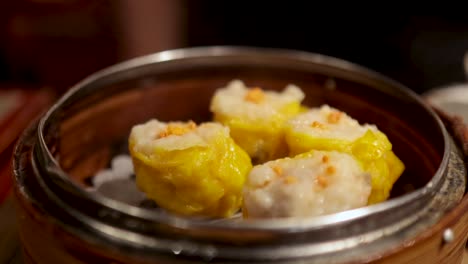 steamed dumplings in a bamboo basket