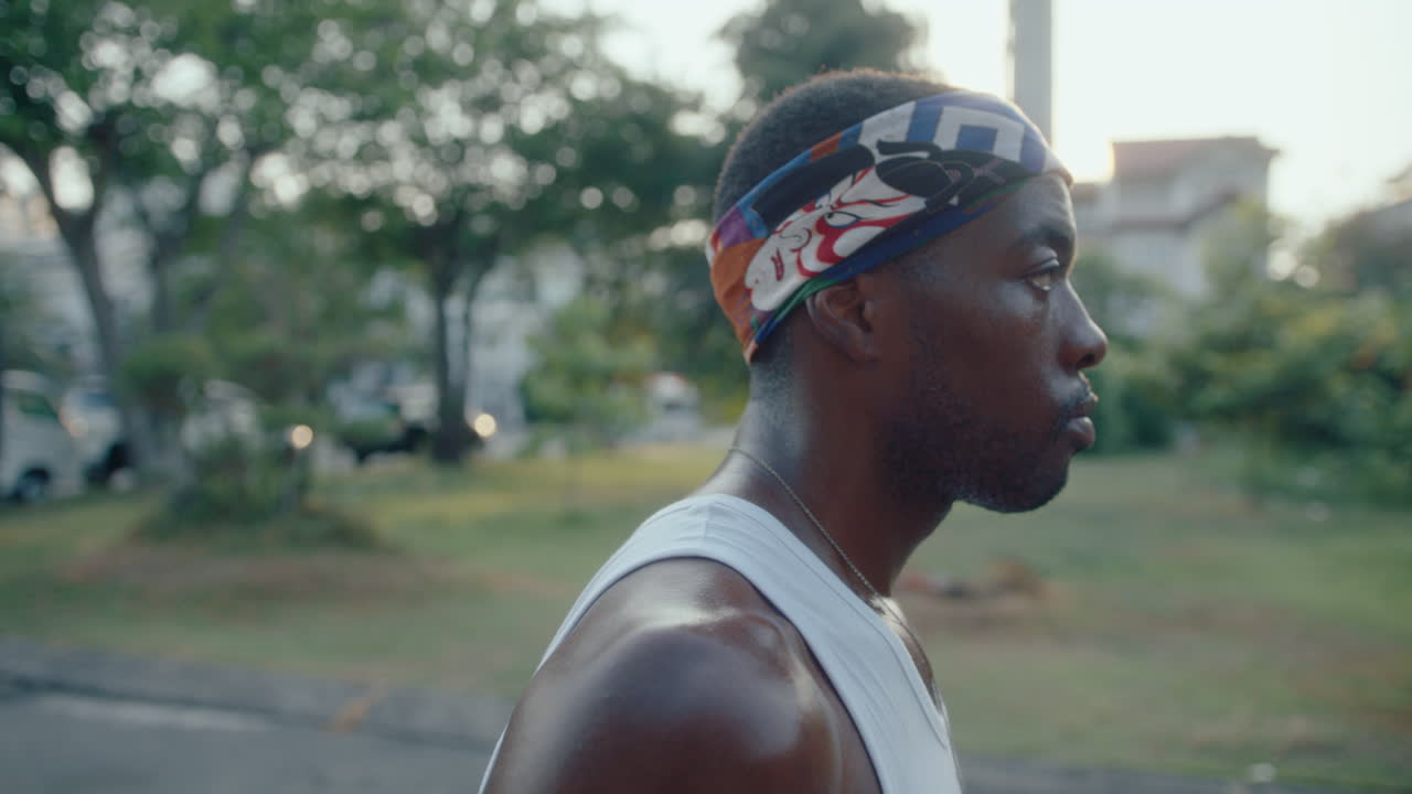 Confident Basketball Player Training on Outdoor Court