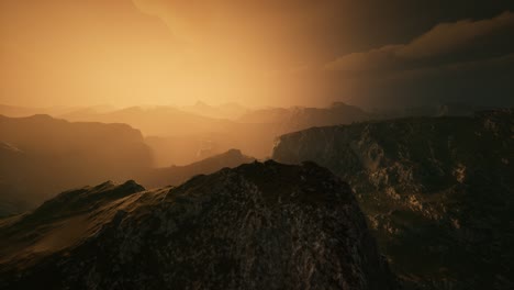 high mountain peaks covered with dramatic heavy fog