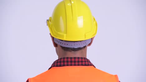 young handsome hispanic man construction worker