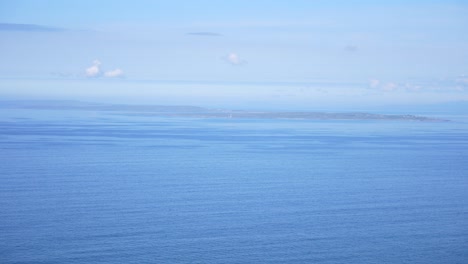 aran islands seen from cliffs of moher in ireland, clear sky, peaceful day