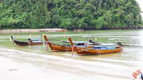 longtail boats on a tropical beach