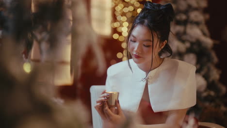 woman enjoying a christmas cocktail