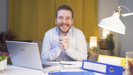 home office worker man looking at camera with excitement and feeling happy.