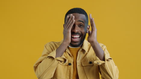 happy man covering face with hands