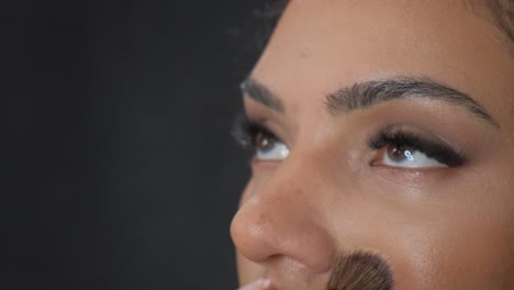 a detailed and intricate view of eye makeup application, showcasing numerous professional techniques used
