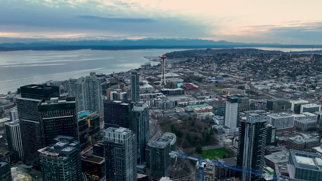 Aerial view of Seattle's downtown skyscrapers during a cloud filled sunset
