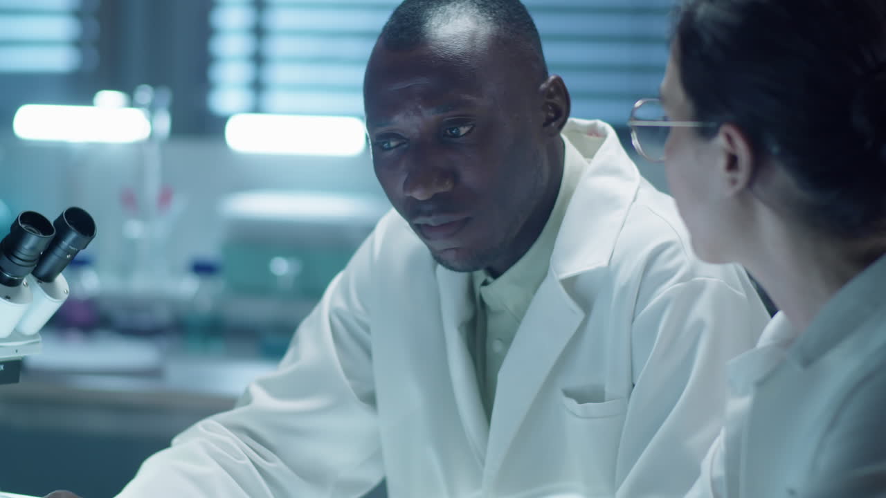 Scientists Discussing Research in Laboratory