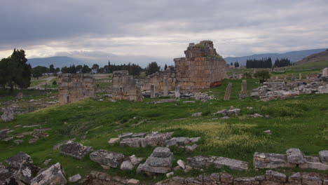 the ruins of buildingsin a field in hierapolis