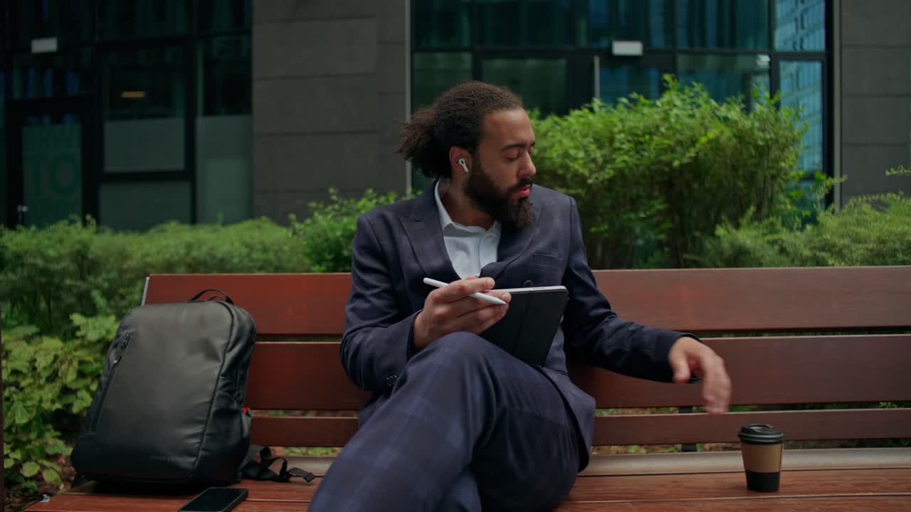 Businessman Working on Tablet Outdoors