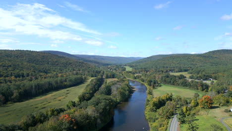 a breathtaking high-altitude drone shot showcasing the winding deerfield river alongside the scenic mohawk trail