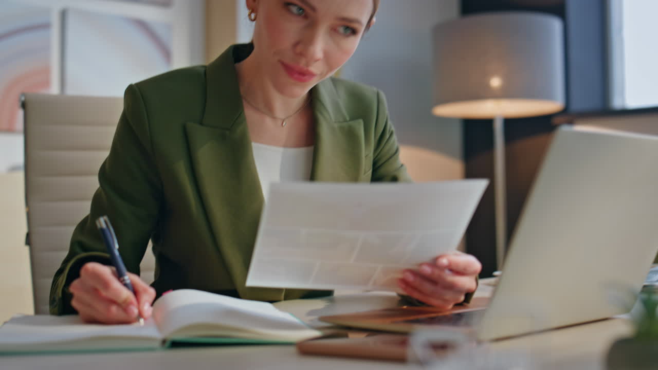 Attractive woman work documents sitting alone at office closeup. Manager writing