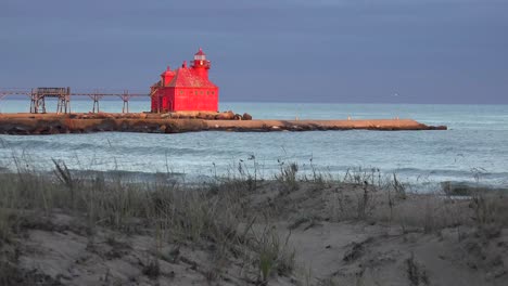 the beautiful sturgeon bay lighthouse in door county wisconsin glows red in the twilight 1