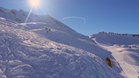 ski area in the swiss alps with people and chairlifts in the winter ski area of beckenried