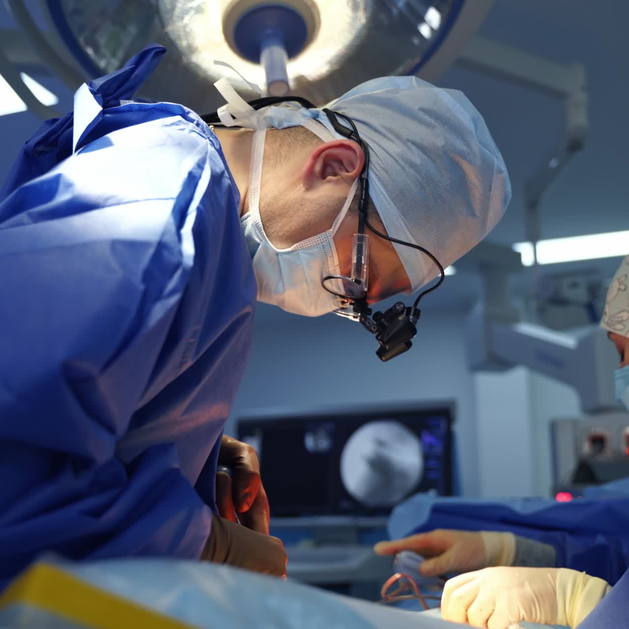 Professional doctors in medical uniform making an operation. Process of operation by neurosurgeons