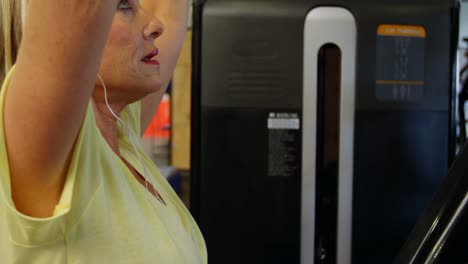 senior woman doing exercise in fitness studio 4k