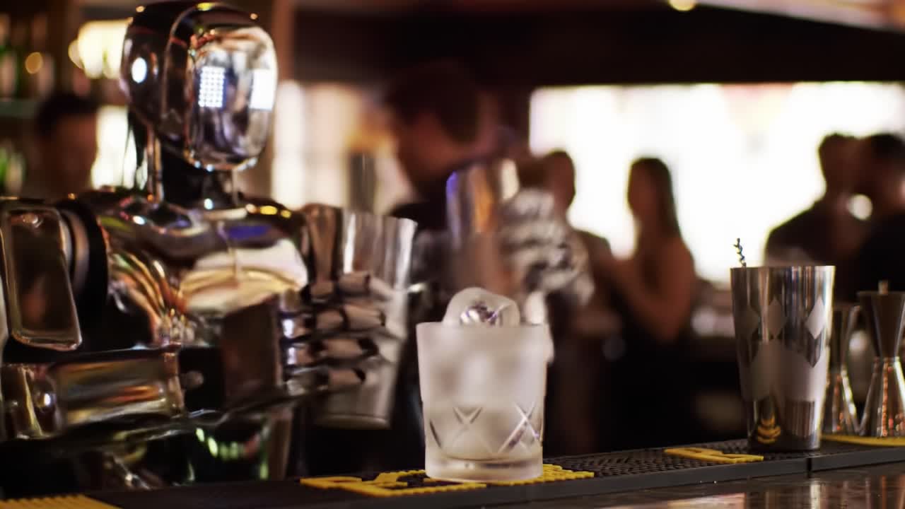 A Robotic Bartender Skillfully Shakes Cocktails in a Vibrant Bar Environment, Showcasing Advanced Mixology Technology and Innovation in Action