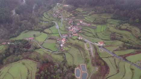 Panoramic-shot-of-small-local-village-Sobrada-Portugal-between-the-hills-during-a-rainy-day,-aerial