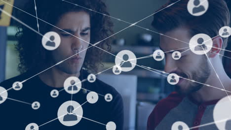 Animation of network of connections with people icons over diverse people in cafe