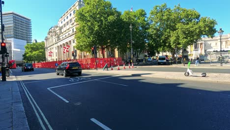 a car drives through a sunny london street