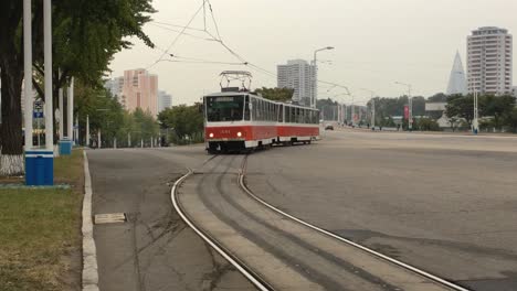 vintage electric tram approaches tram stop in downtown pyongyang, north korea