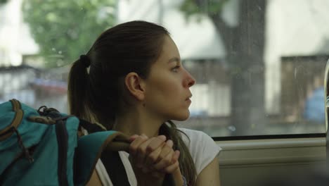 backpacker tourist woman traveling in window of transport