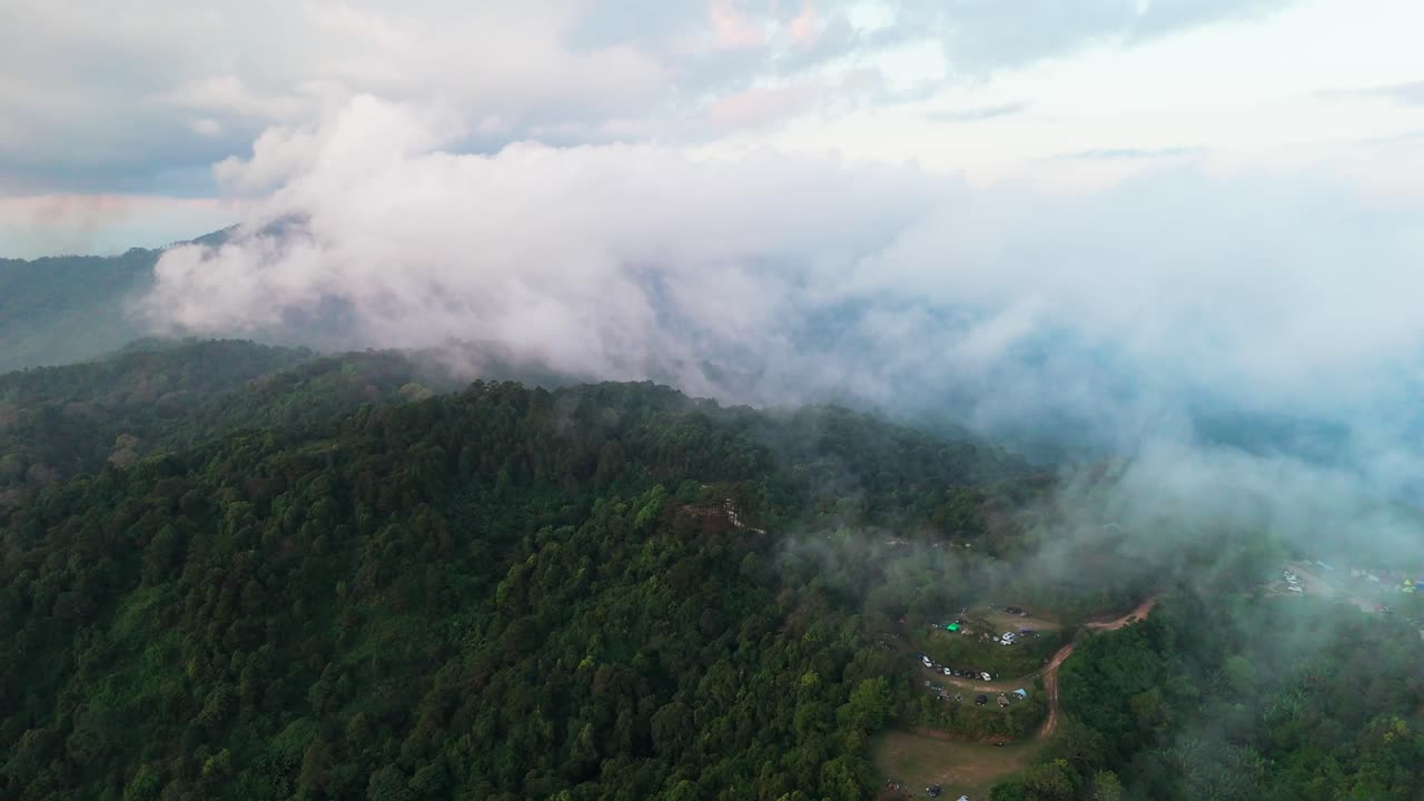 Aerial wide view of national park forest and mountains, featuring dense greenery and valleys