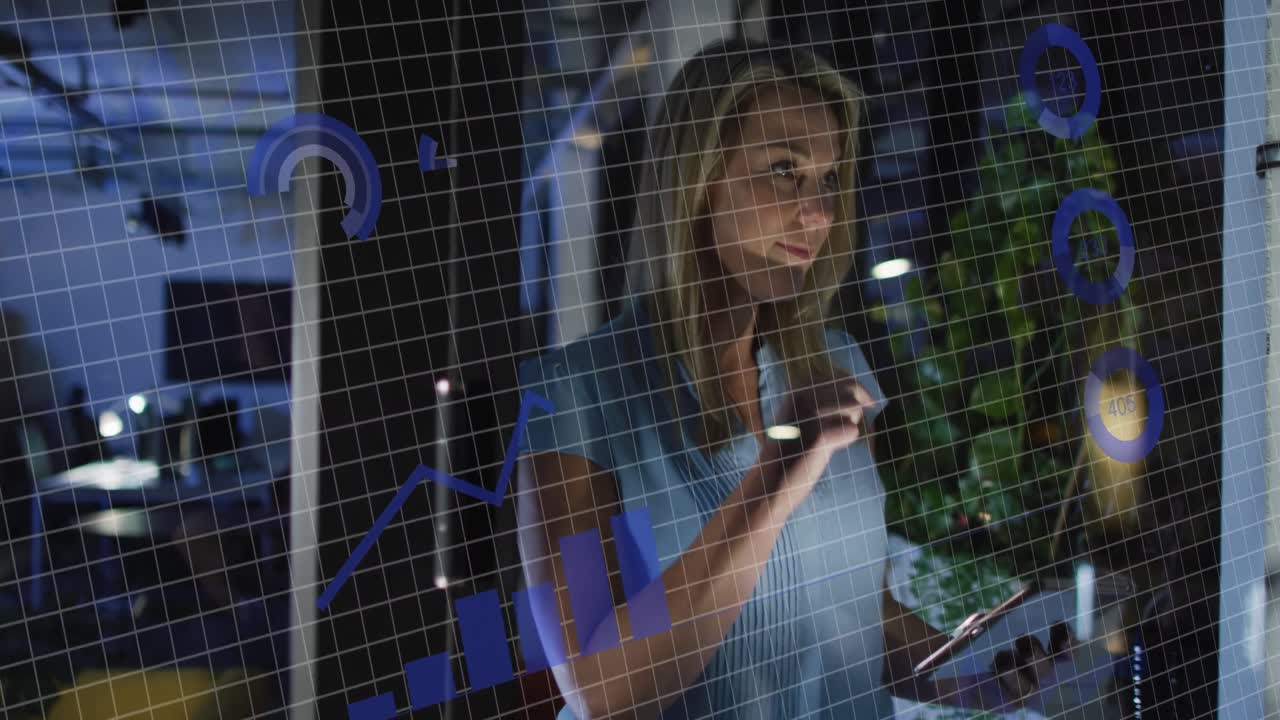 Animation of financial data processing over caucasian businesswoman working in office