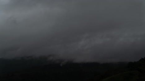 time lapse of arenal volcano covered in clouds during rainy season.