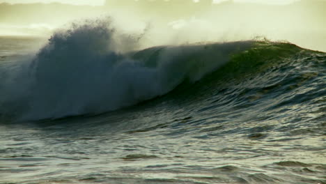 large waves as they crest and break in slow motion