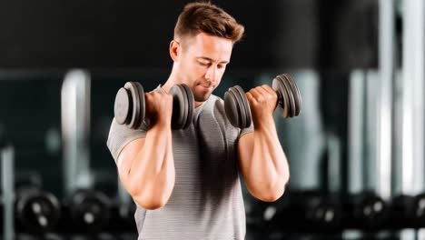 man exercising with dumbbells in a gym