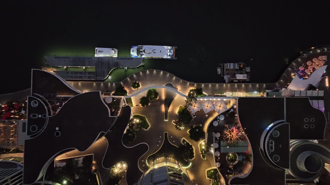 Topdown aerial shot of Brisbane City's Eagle Street Pier boardwalk at night time