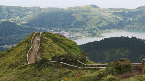 beautiful hiking trail in the azores with mountain view to crater lake