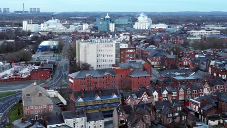 aerial view looking down suburban city centre streets urban infrastructure traffic descending pan left