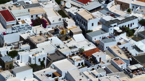Telephoto drone shot of unique architecture in the Lindos town, in sunny Rhodes