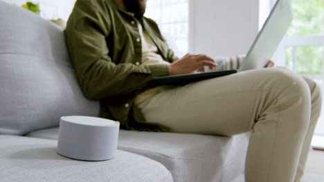 Close-up-view-of-smart-speaker-on-the-sofa