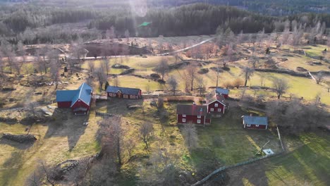 AERIAL---Sunny-Asens-By-Culture-Reserve-in-Smaland,-Sweden,-scenic-shot-forward