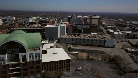 aerial pulling out from the city of high point north carolina revealing the market square complex