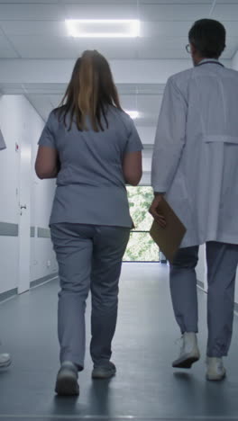 hospital staff walking down corridor