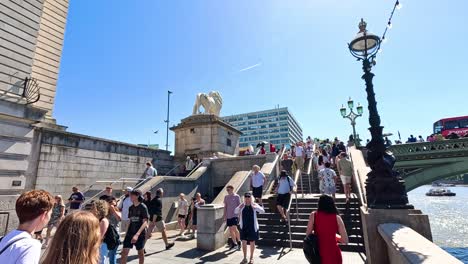 crowds walking near westminster bridge in london