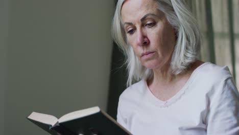 portrait of senior caucasian woman sitting at home