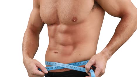 Muscular-man-measuring-his-waist